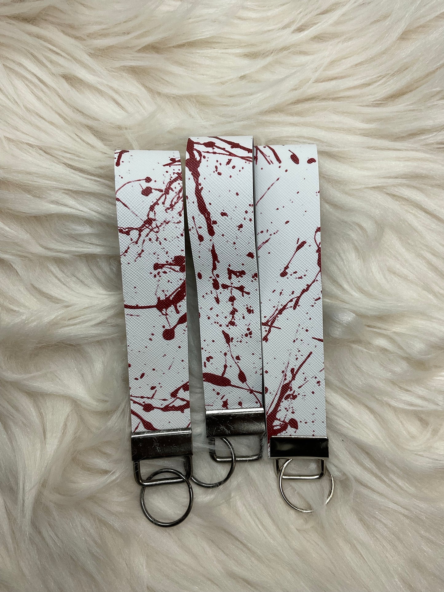 white blood splatter keychain wristlet